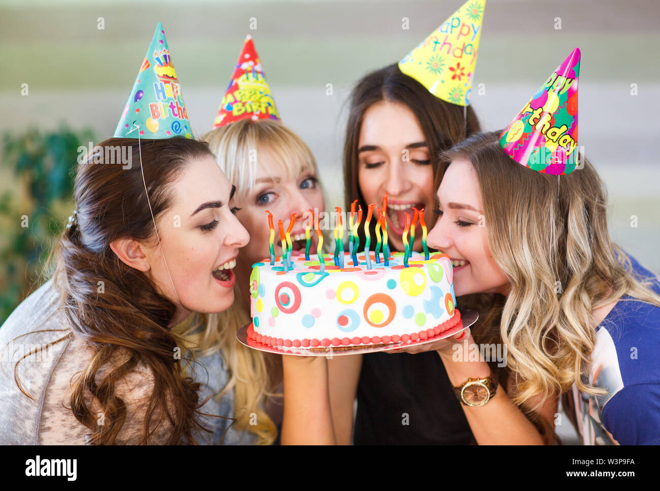 Birthday. Girls bite cake at a birthday party Stock Photo - Alamy Birthday. Girls bite cake at a birthday party Stock Photo - Alamy