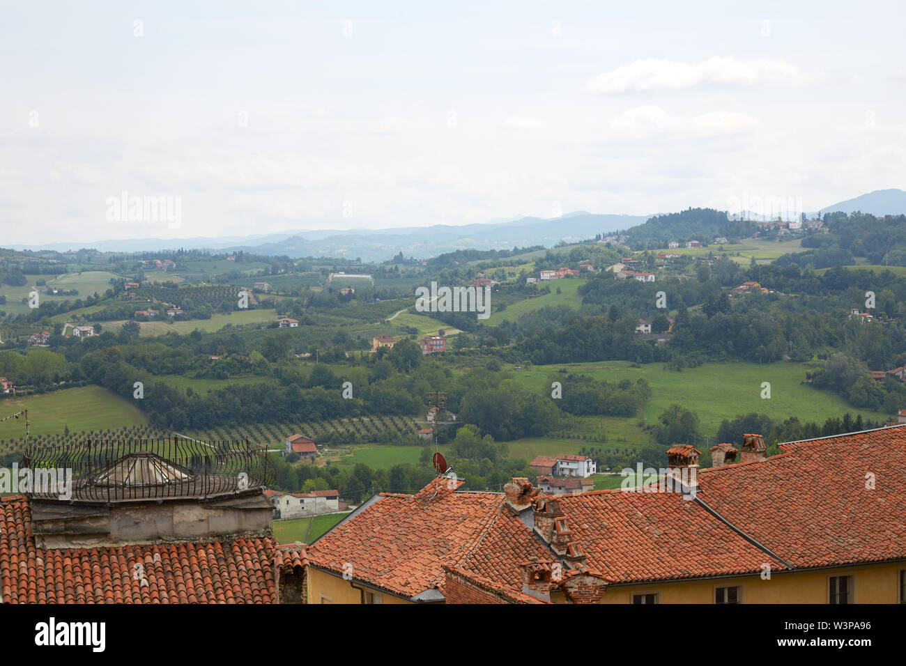 Green hills view and rooftops from panoramic viewpoint in Mondovi, Piedmont, Italy Stock Photo