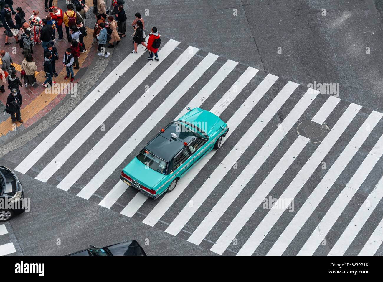 Shibuya Crossing, car driving on zebra crossing, Shibuya, Udagawacho, Tokyo, Japan Stock Photo