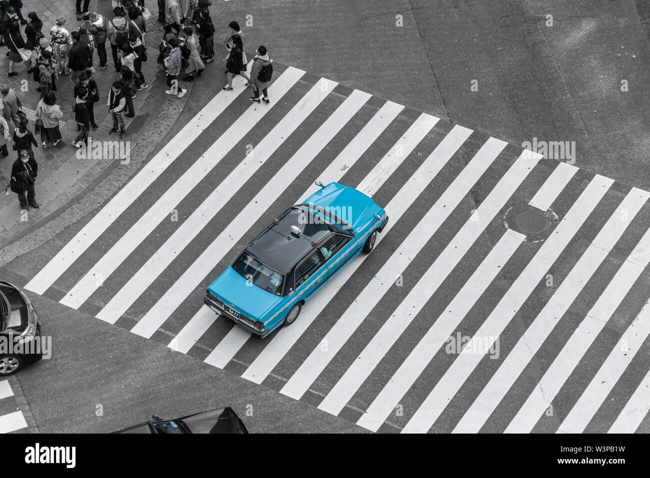 Shibuya Crossing, car driving on zebra crossing, Shibuya, Udagawacho, Tokyo, Japan Stock Photo
