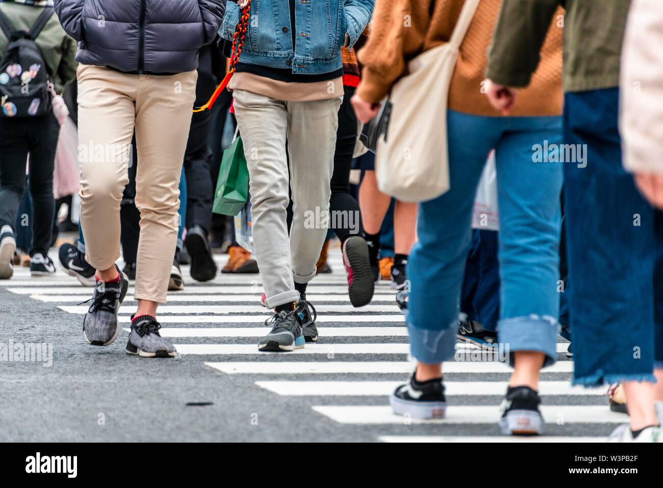 Pedestrian, crowd, many people crossing zebra crossing, close-up, Shibuya Crossing, Shibuya, Udagawacho, Tokyo, Japan Stock Photo