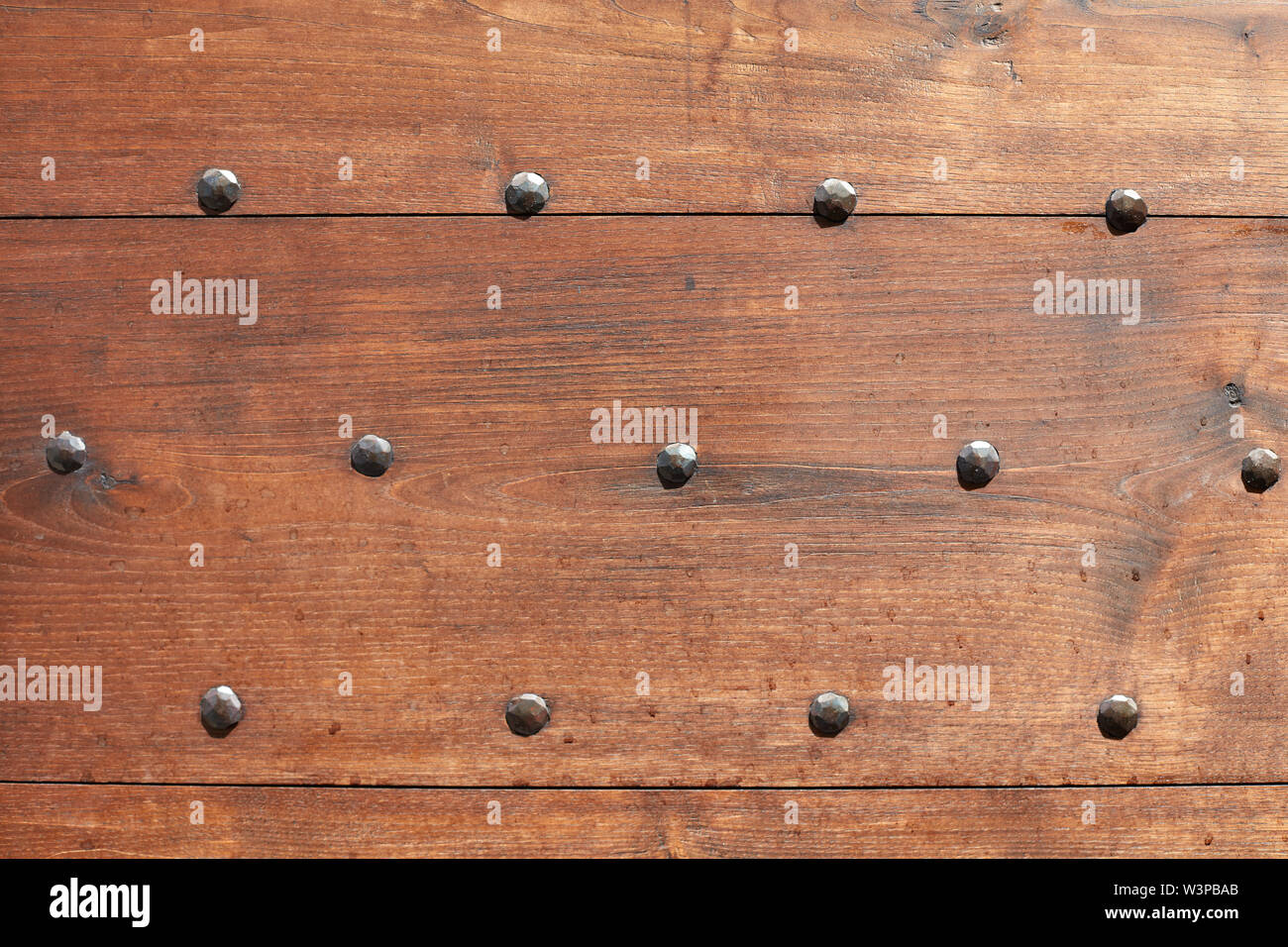 Wooden door with nails texture background Stock Photo