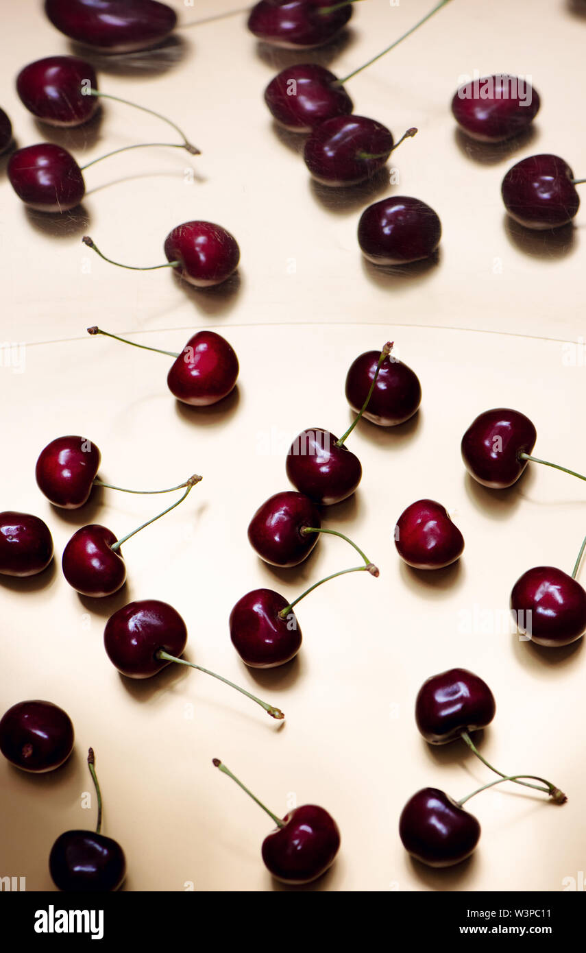Sweet ripe cherries on golden background with mirror reflection Stock ...