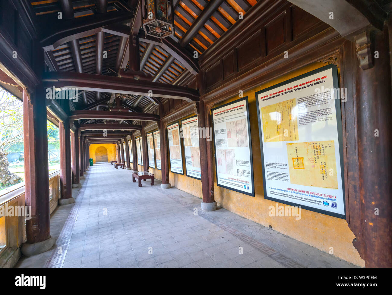 Amazing wooden hallway in the imperial Forbidden Citadel. The place that leads to the palaces of kings, feudal officials in the 19th century in Hue, V Stock Photo