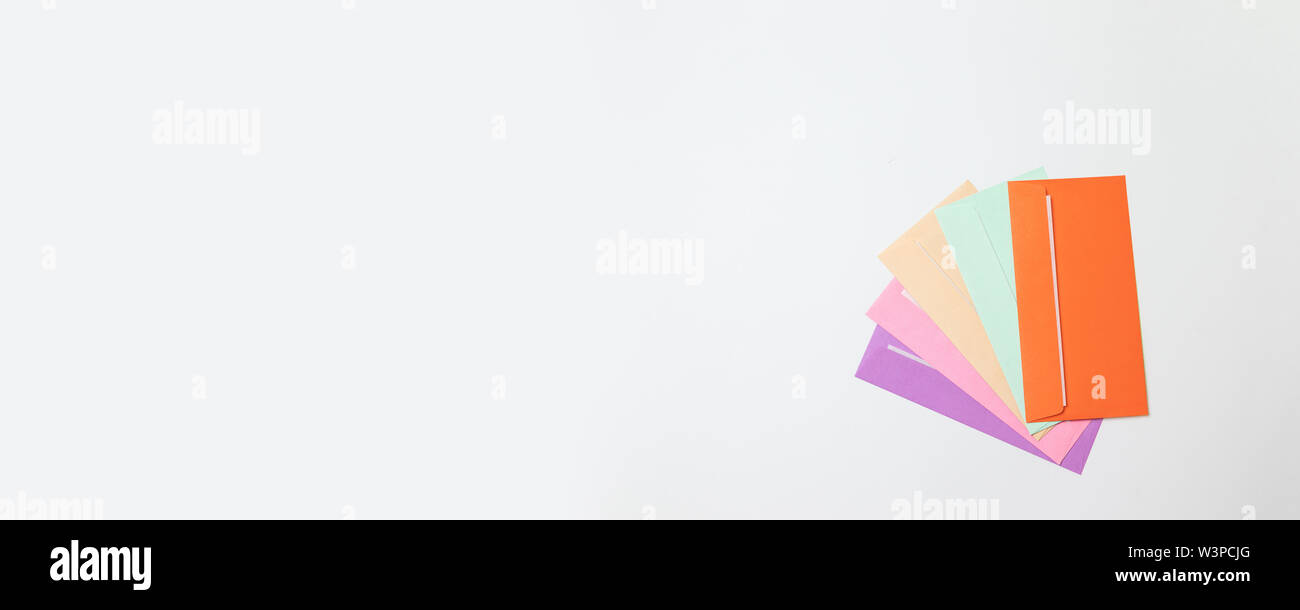 Different colored envelopes on a gray monochrome background. Hello spring Stock Photo