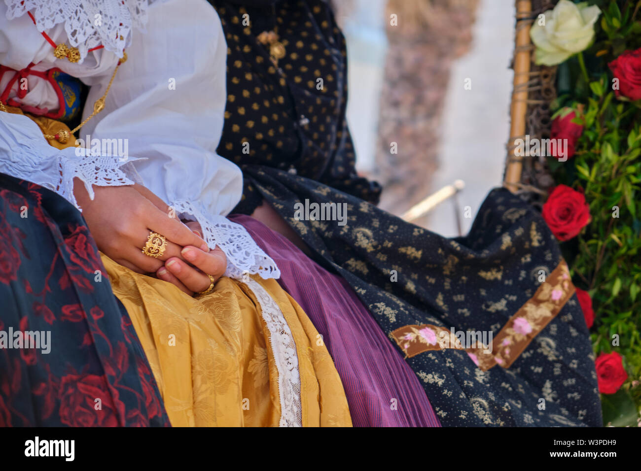 A woman dressed in typical Sardinian costume with different Sardinian ornamental golden jewels. Typical sardinian. Stock Photo