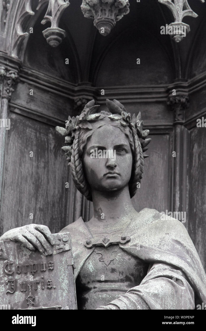 statue of Themis, the scales of justice and the letter of law. Themis in Greek mythology the