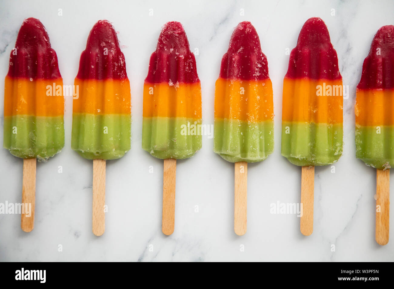 Summer fruit ice lolly popcicle on a marble background Stock Photo