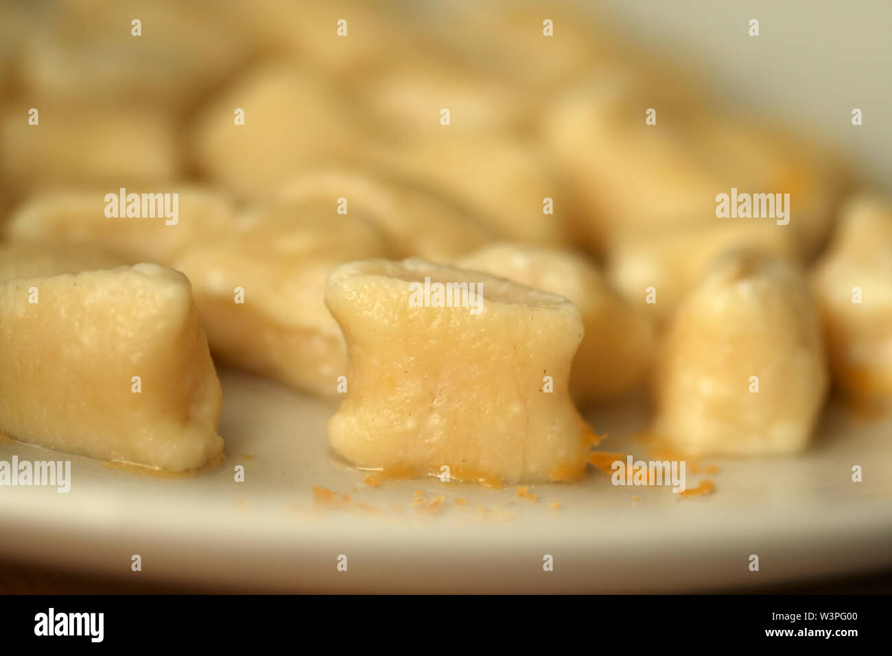 Homemade noodles gnocchi with cheese mimolette Stock Photo