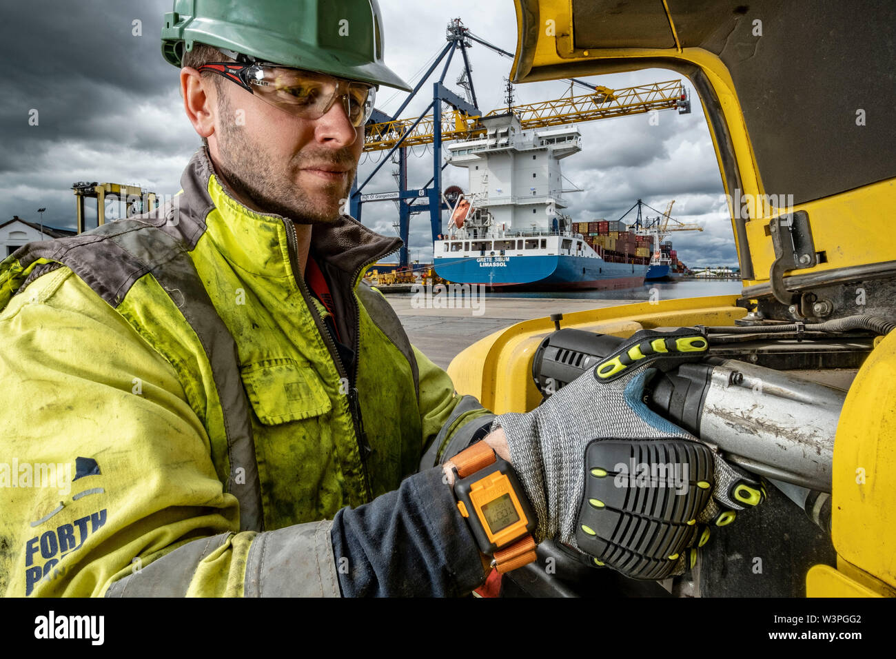 Skilled workers using power tools Stock Photo