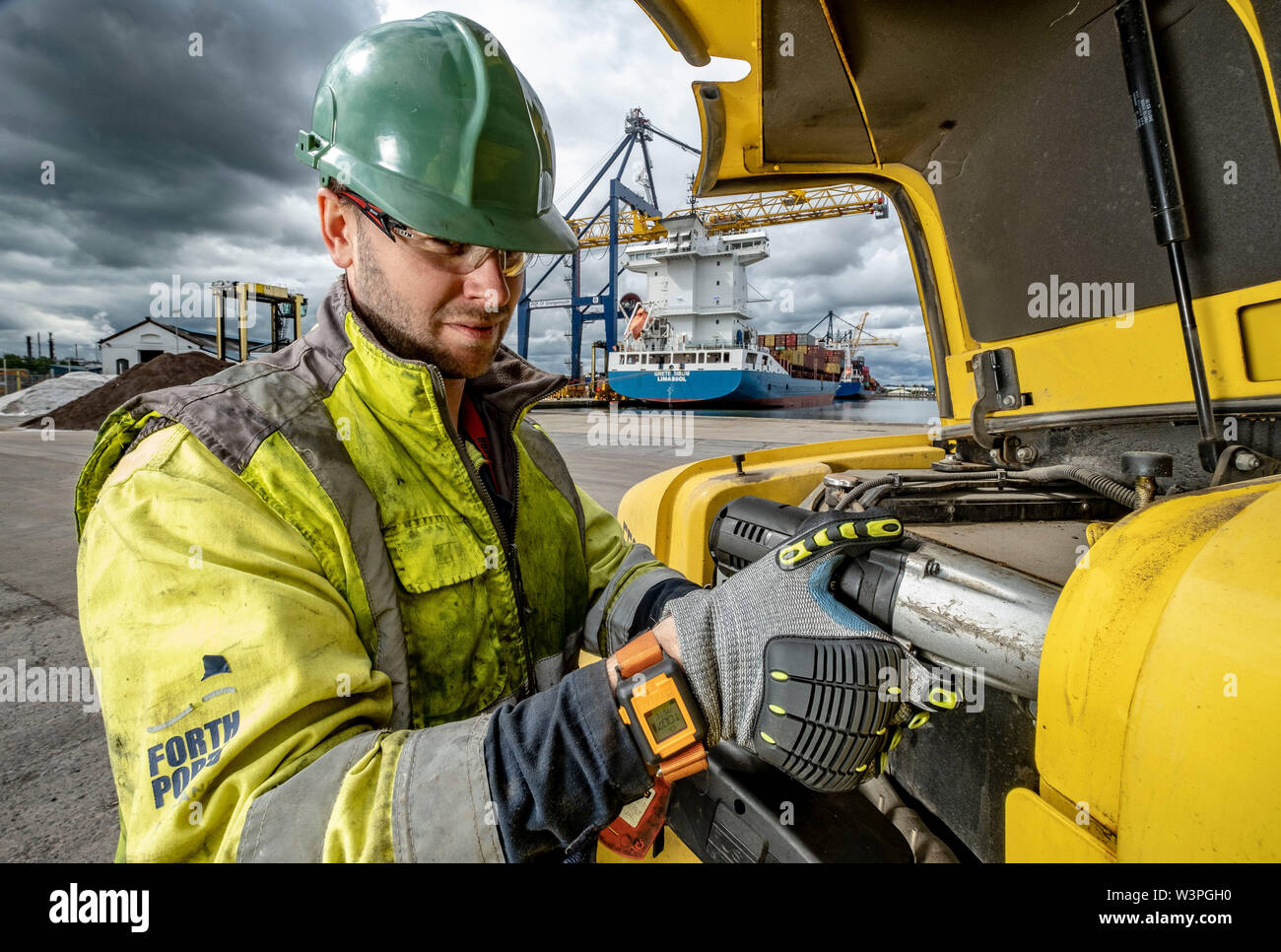 Skilled workers using power tools Stock Photo
