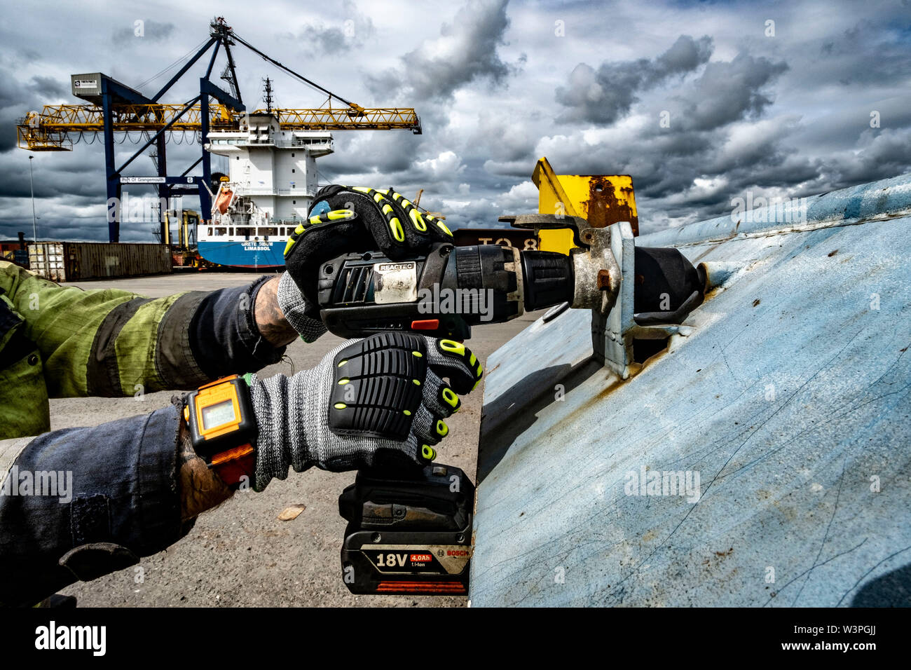 Skilled workers using power tools Stock Photo