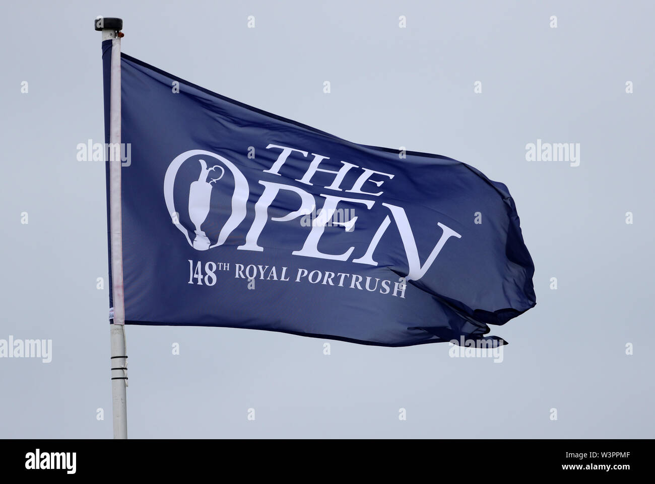 A The Open flag blows in the wind during preview day four of The Open Championship 2019 at Royal Portrush Golf Club. Stock Photo