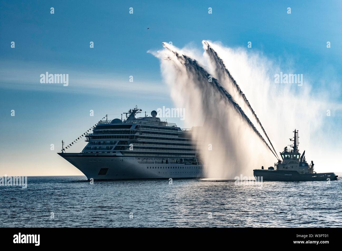 Viking Jupiter being welcomed to Scotland with a water cannon salute Stock Photo