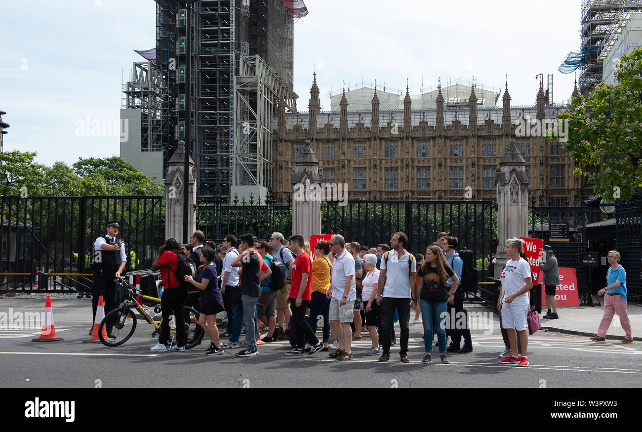 Westminster, London, UK. 17th July, 2019. Security is tight in Westminster as the  Prime Minister arrives ahead of Prime Minister's Questions in Parliament today.  Remain protesters stand outside Parliament with their EU flags. Credit: Maureen McLean/Alamy Live News Stock Photo
