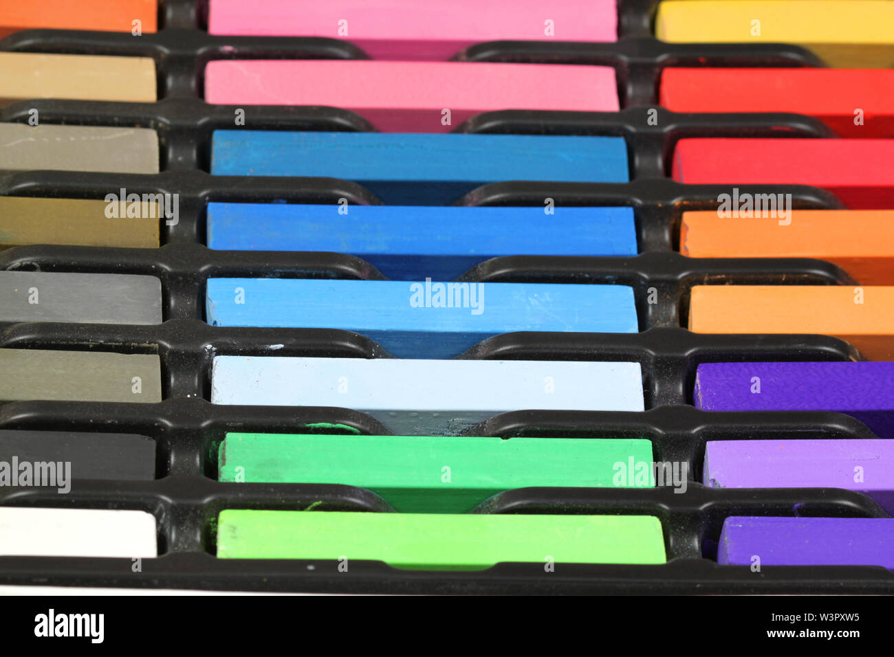 Multicolored pastel chalks for artist drawing in box Stock Photo Alamy