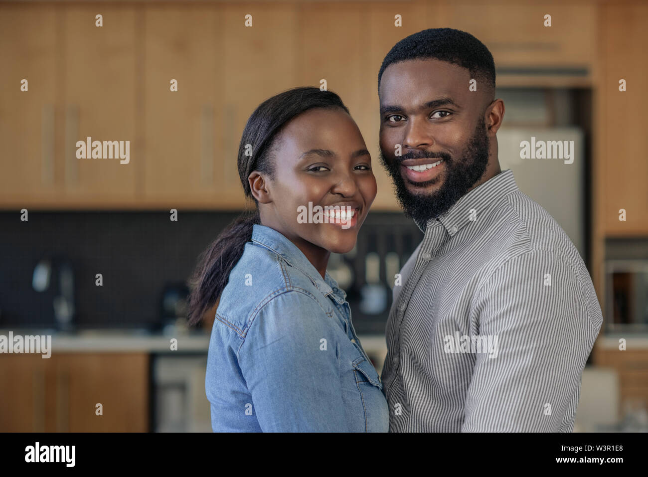 Affectionate young African American couple standing close together at home Stock Photo