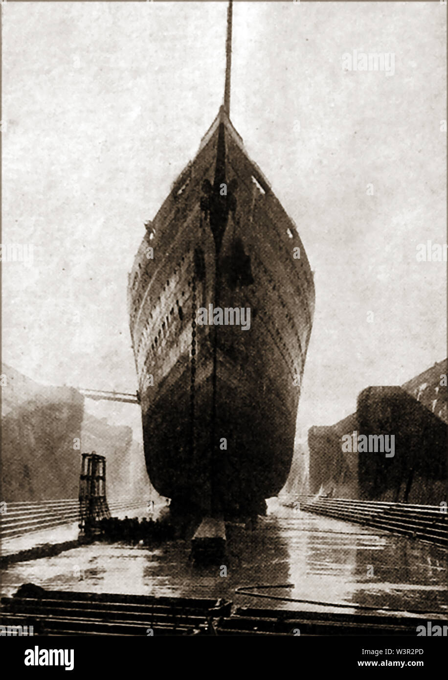 MAJESTIC /BISMARCK/ CALEDONIA - RMS Majestic was a White Star flagship ocean liner built in  1914, the largest ship in the world until completion of SS Normandie in 1935. It's seen here  in the former Southern Railway (King George V) Dry dock  in 1934 and after she was saved from the scrapyard by  the Royal Navy, renamed and became the training ship HMS Caledonia before catching fire in 1939 and sinking. - She was originally  launched in 1914 as the Hamburg America Line liner SS Bismarck Stock Photo