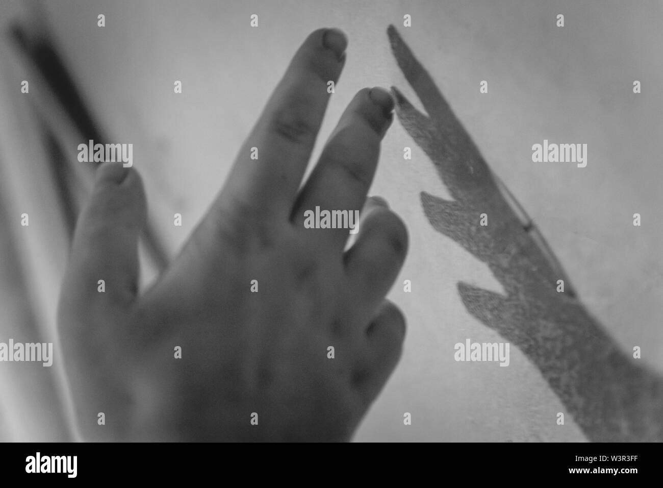 Scary hand shadow on wall hi-res stock photography and images - Alamy