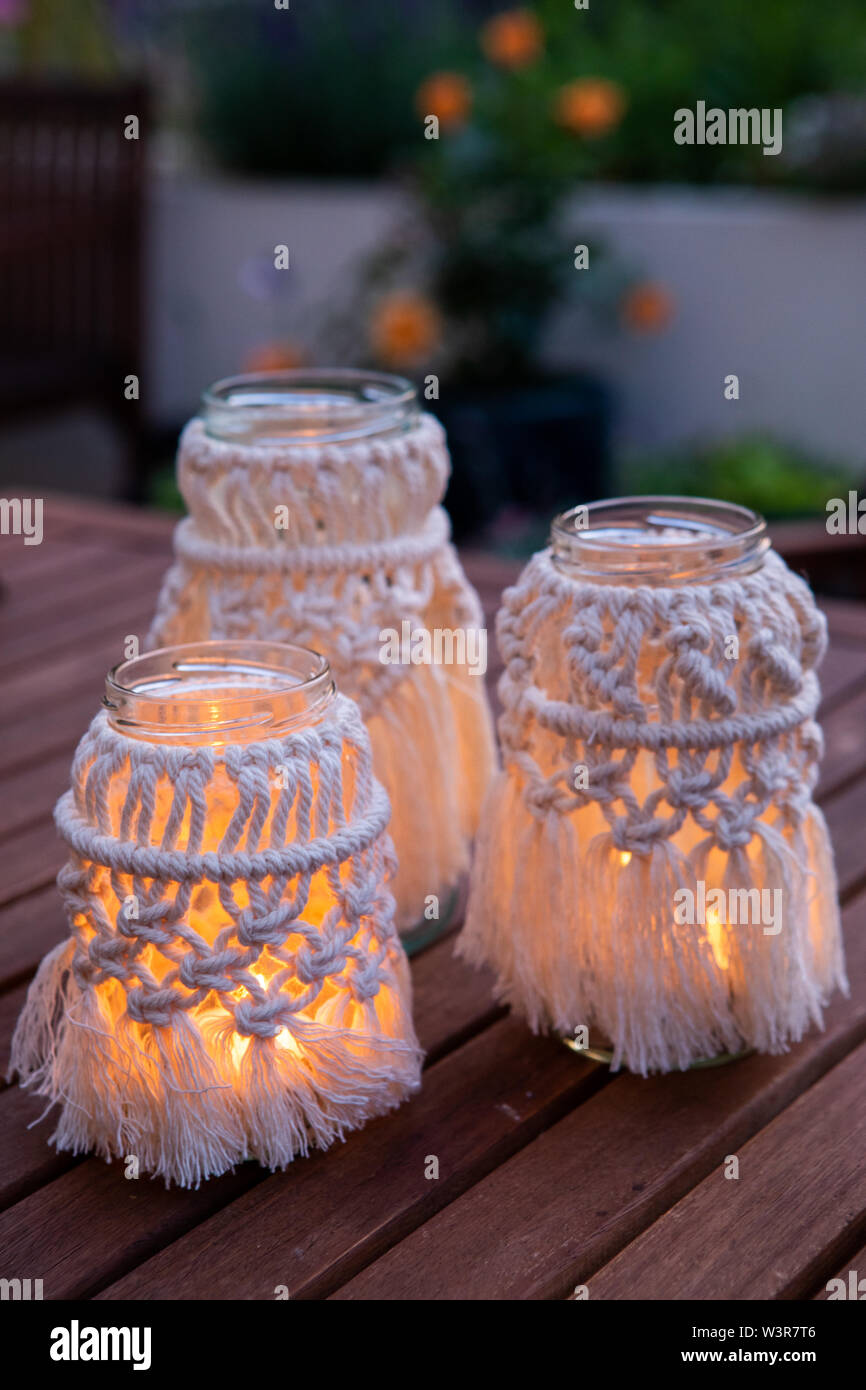 A macrame jam jar cover makes a light for outdoors UK Stock Photo