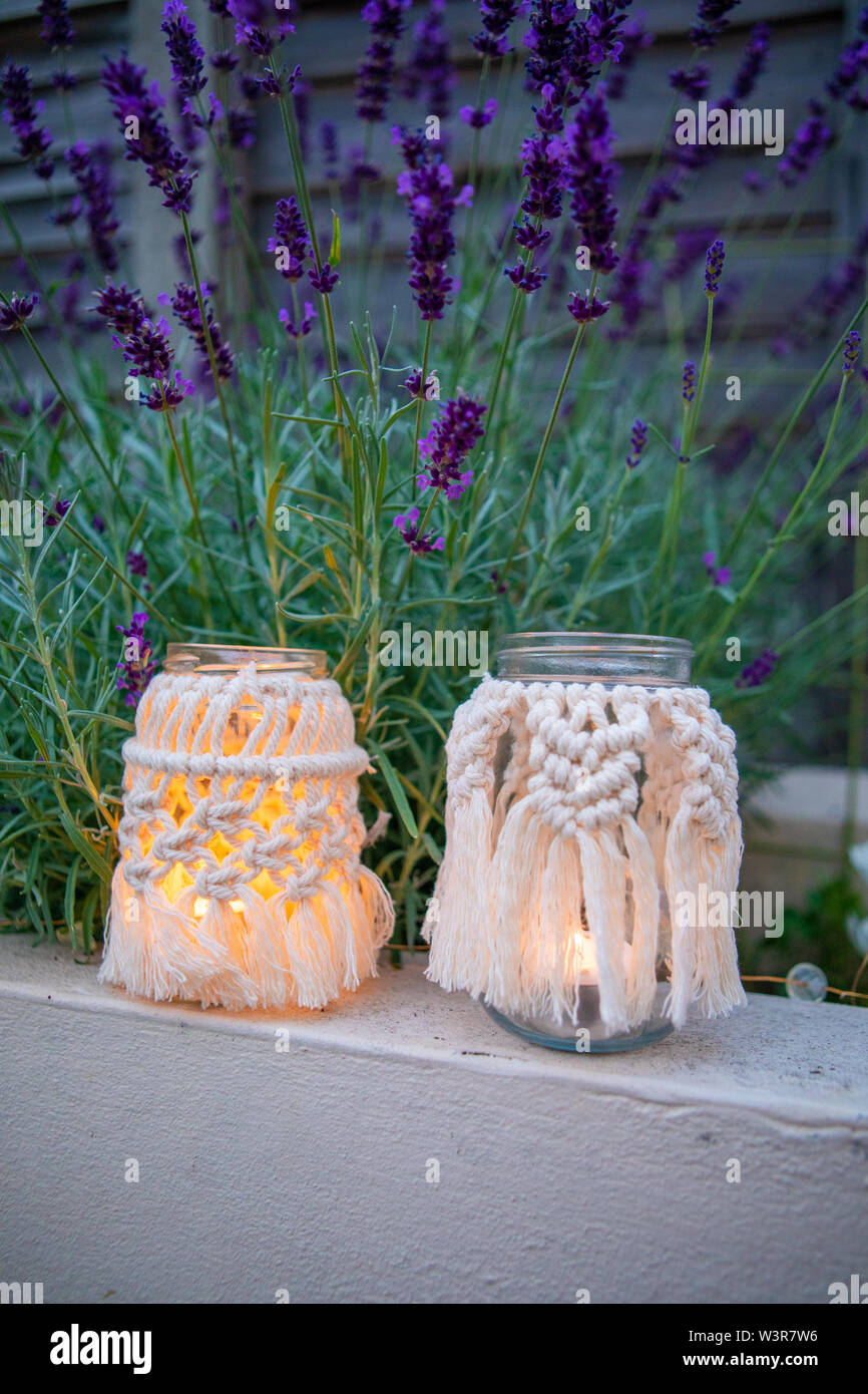 A macrame jam jar cover makes a light for outdoors UK Stock Photo