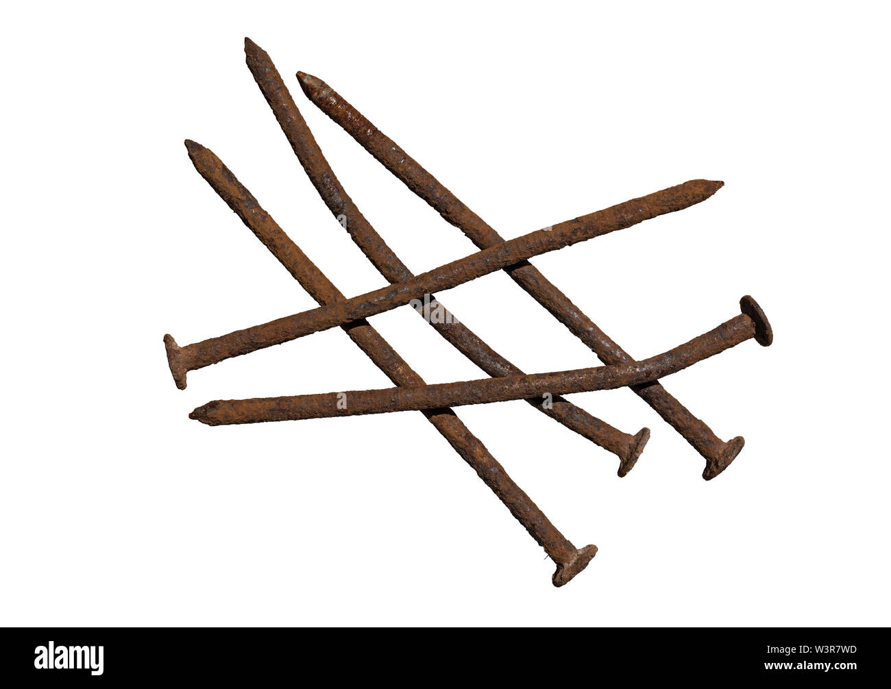 five old rusty and crooked nails isolated Stock Photo