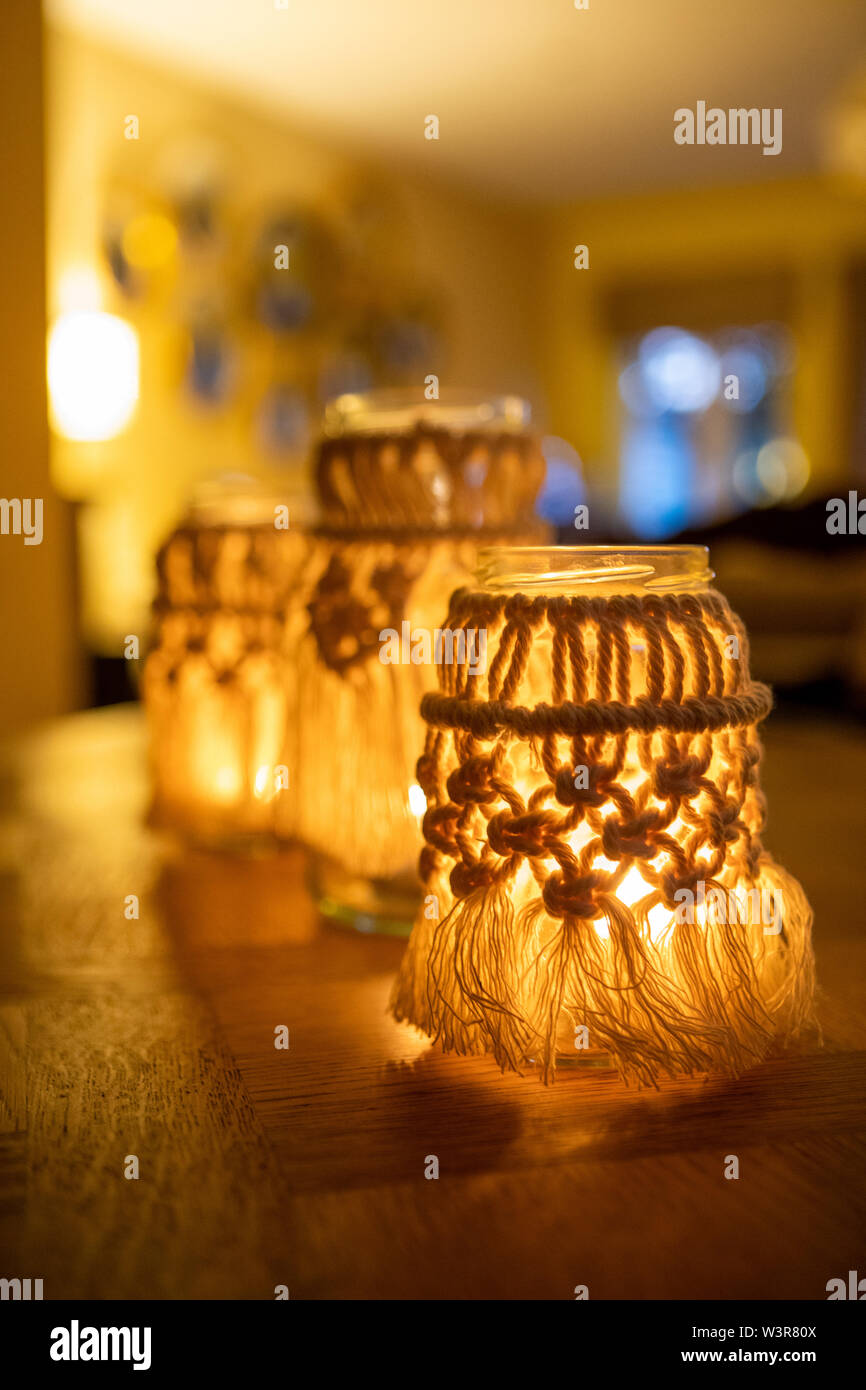 A macrame jam jar cover makes a light for indoors UK Stock Photo