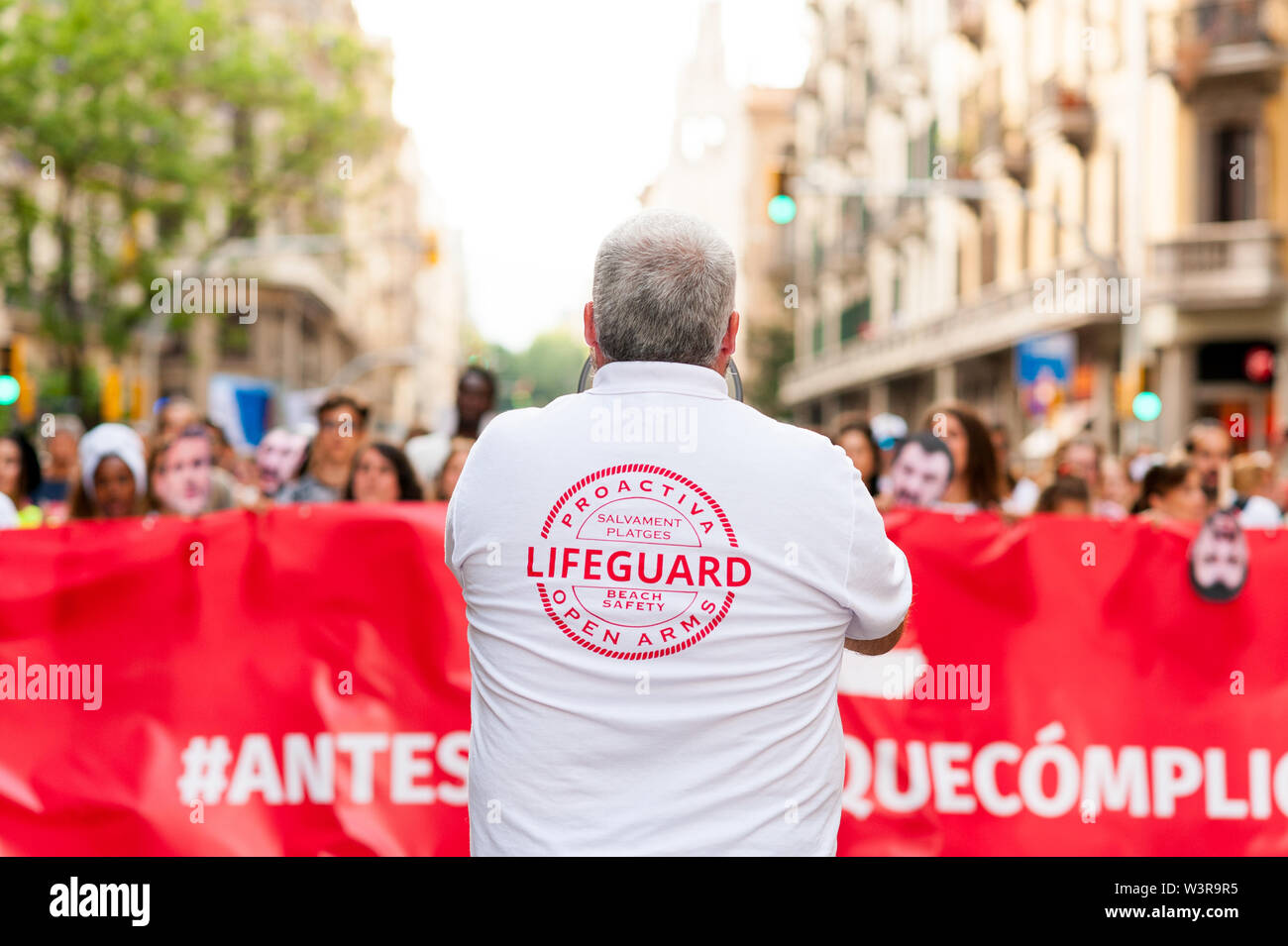 Barcelona, spain- 17 july 2019: proactiva open arms march holding banner in  protest against european immigration policies and in support of ngo in th Stock Photo