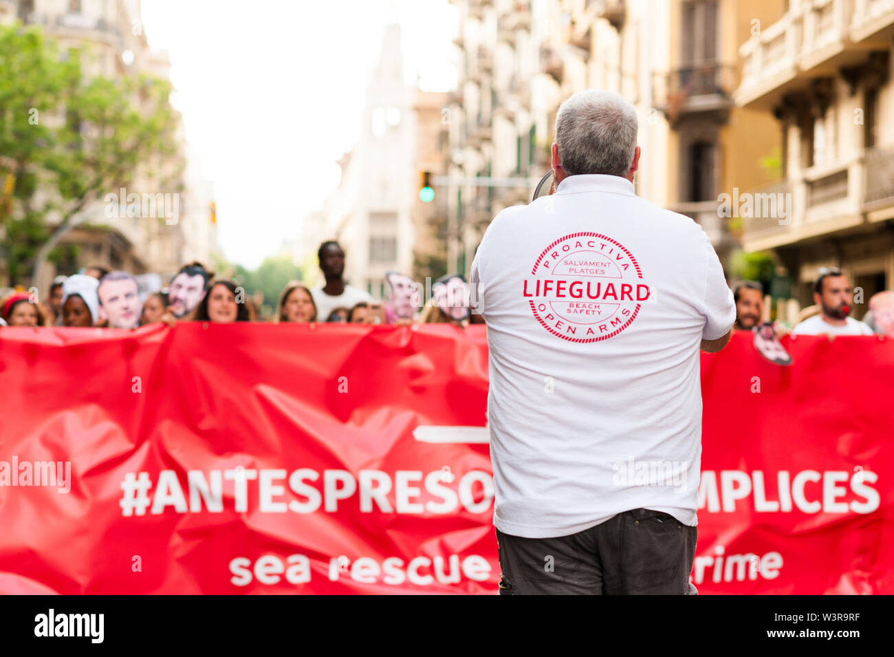 Barcelona, spain- 17 july 2019: proactiva open arms march holding banner in  protest against european immigration policies and in support of ngo in th Stock Photo