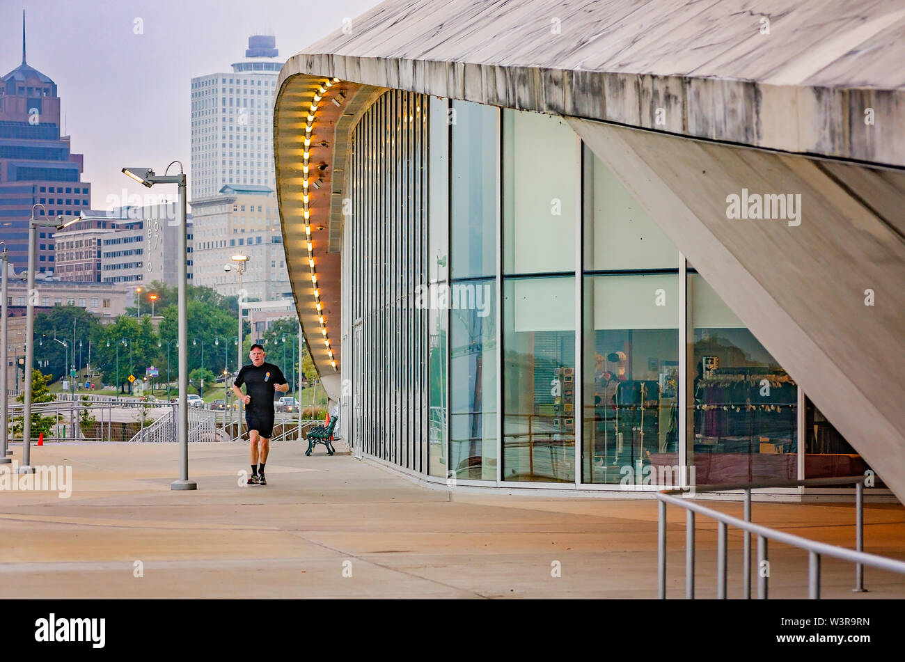 A man jogs past Riverfront Bar & Grill at Beale Street Landing, Sept. 6, 2015, in Memphis, Tennessee. Stock Photo