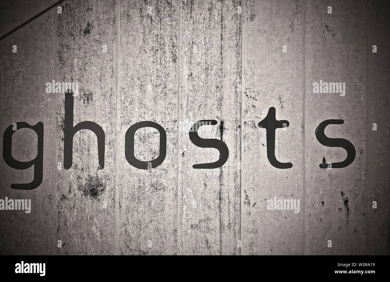 The word “ghosts” is painted on a wall, Sept. 13, 2015, in Memphis, Tennessee. Many locations in the city are said to be haunted. Stock Photo
