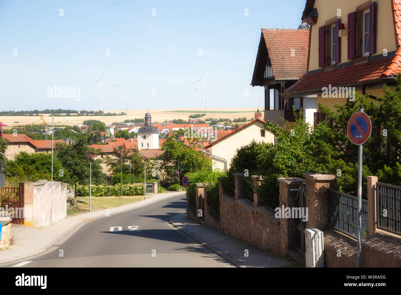 Real estate agent in front of residential villas hires stock