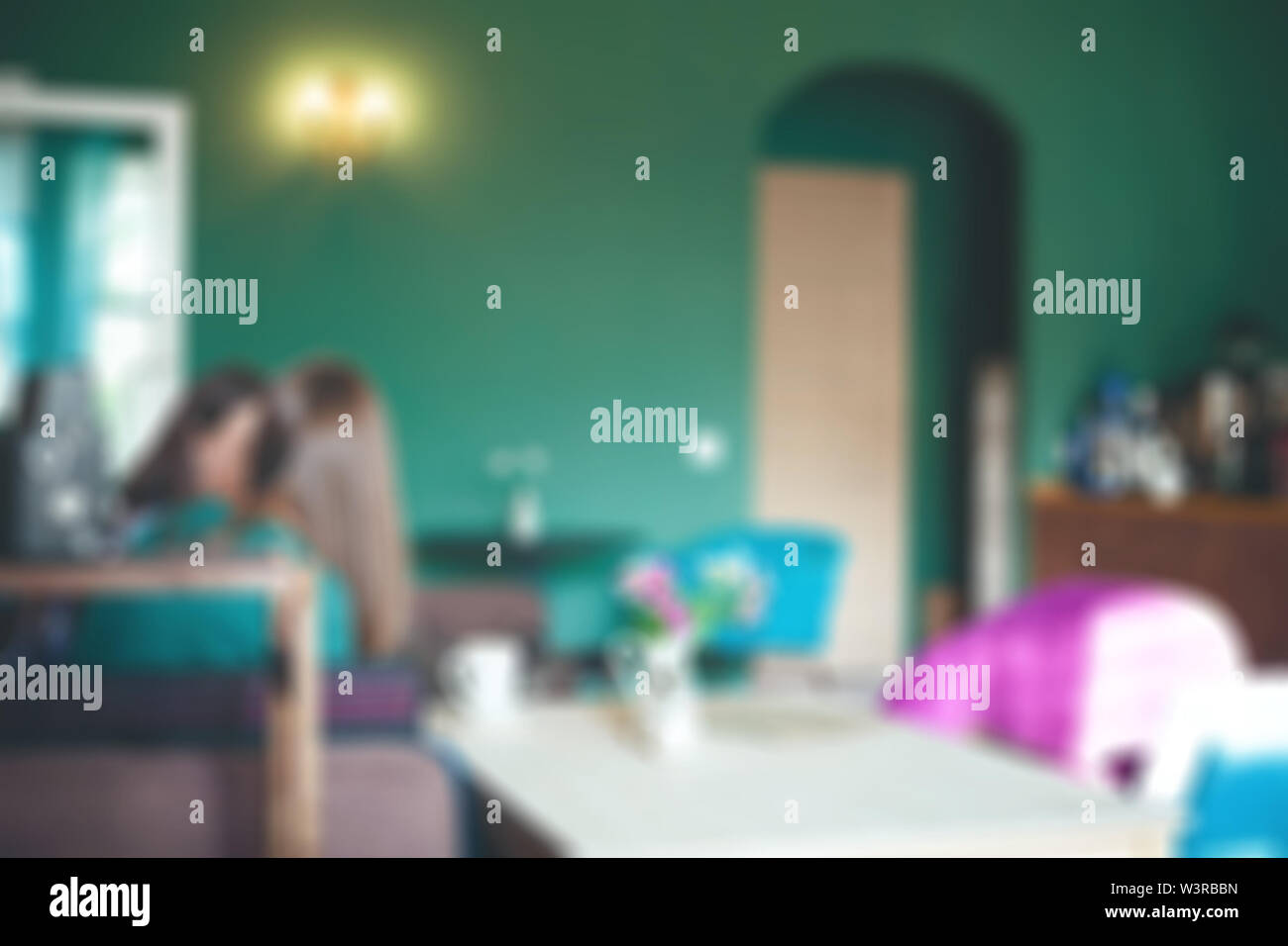 Blurred cafe or coffee shop background with green walls Stock Photo Alamy