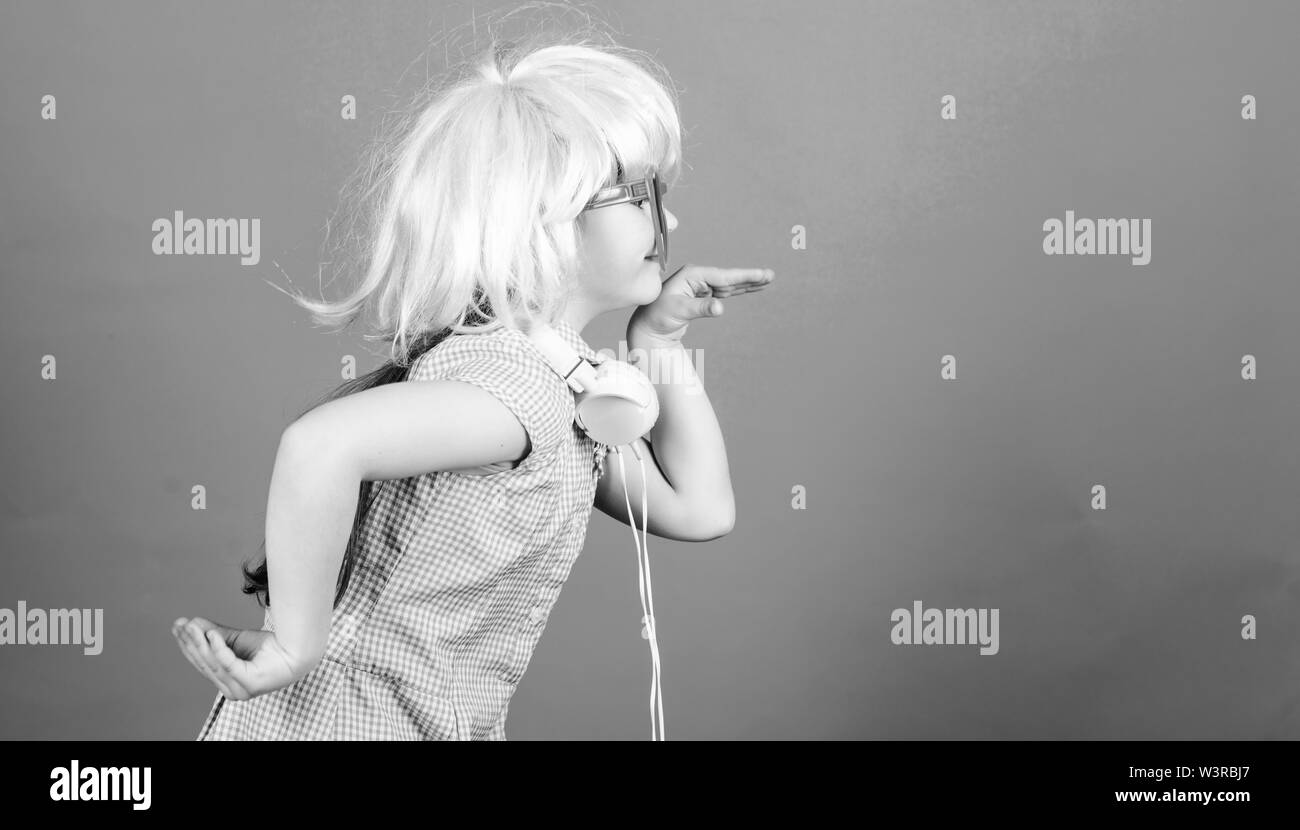 Inspired by music. Little kid listening music. Cute kid with headphones blue background. Small