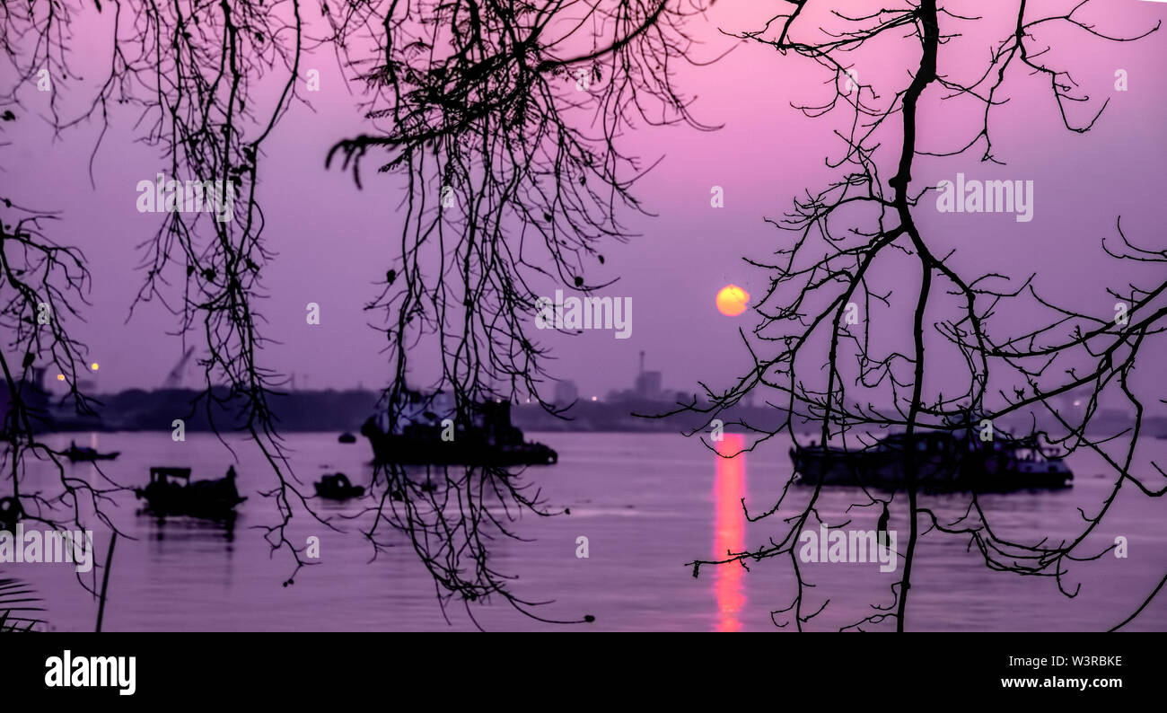 Sunset,on,River Ganga,during,Christmas,celebration,festival,time,Kolkata,India. Stock Photo