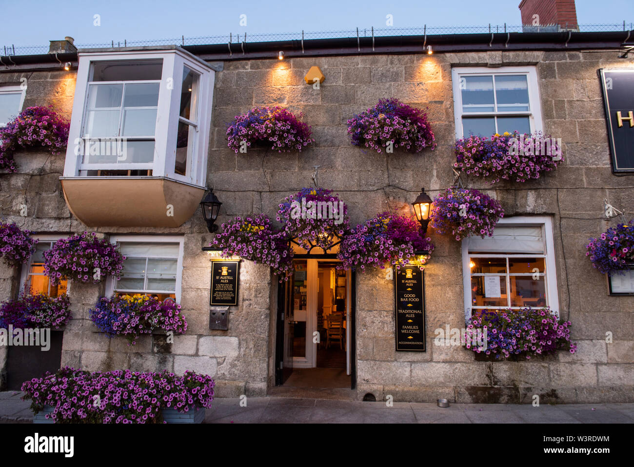 Summer sunset at the Harbour Inn at Porthleven in Cornwall, England UK Stock Photo