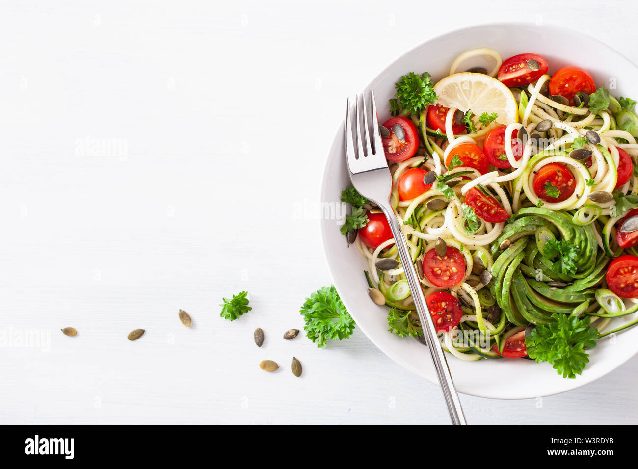 vegan ketogenic spiralized courgette salad with avocado tomato pumpkin