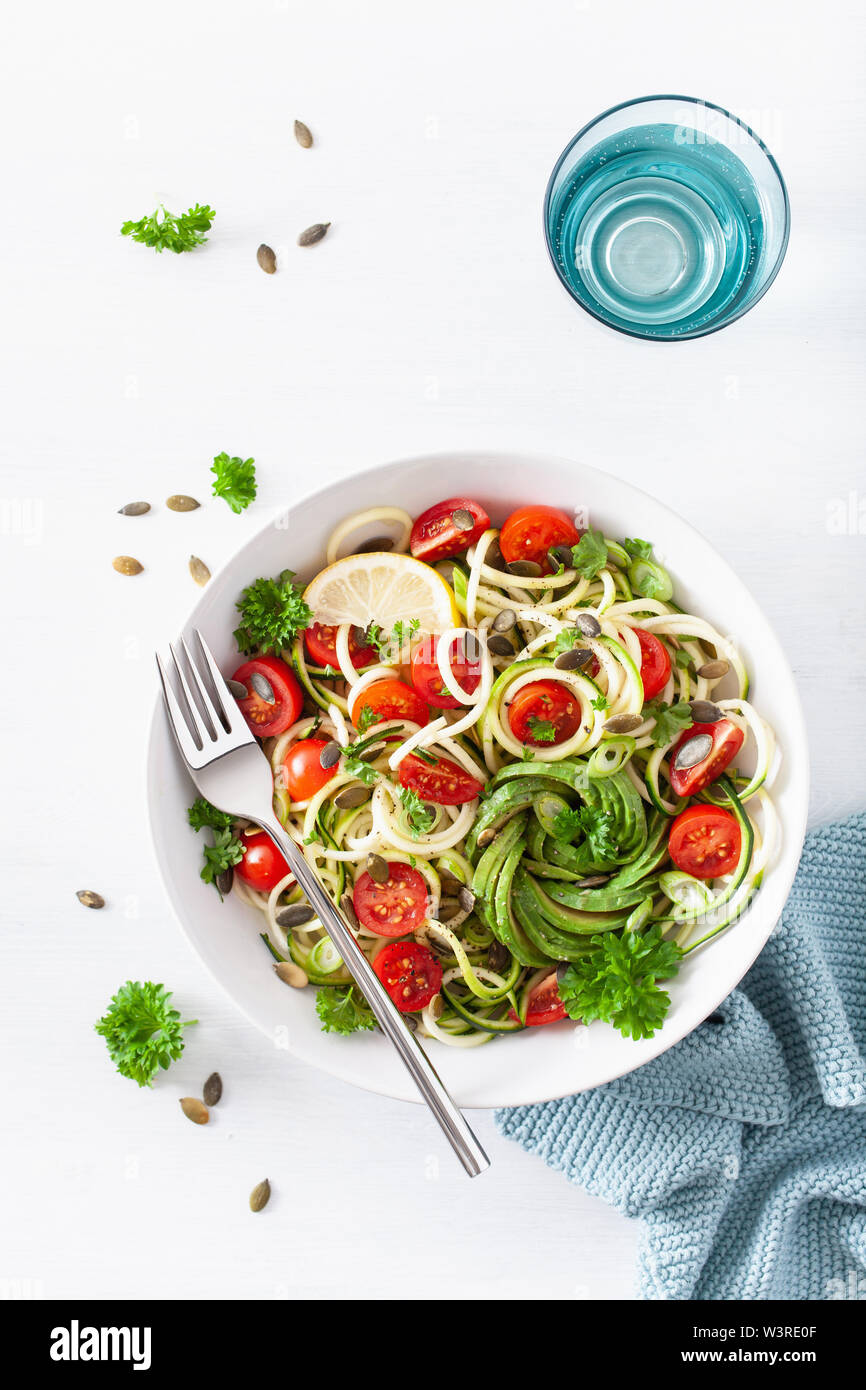vegan ketogenic spiralized courgette salad with avocado tomato pumpkin seeds Stock Photo Alamy