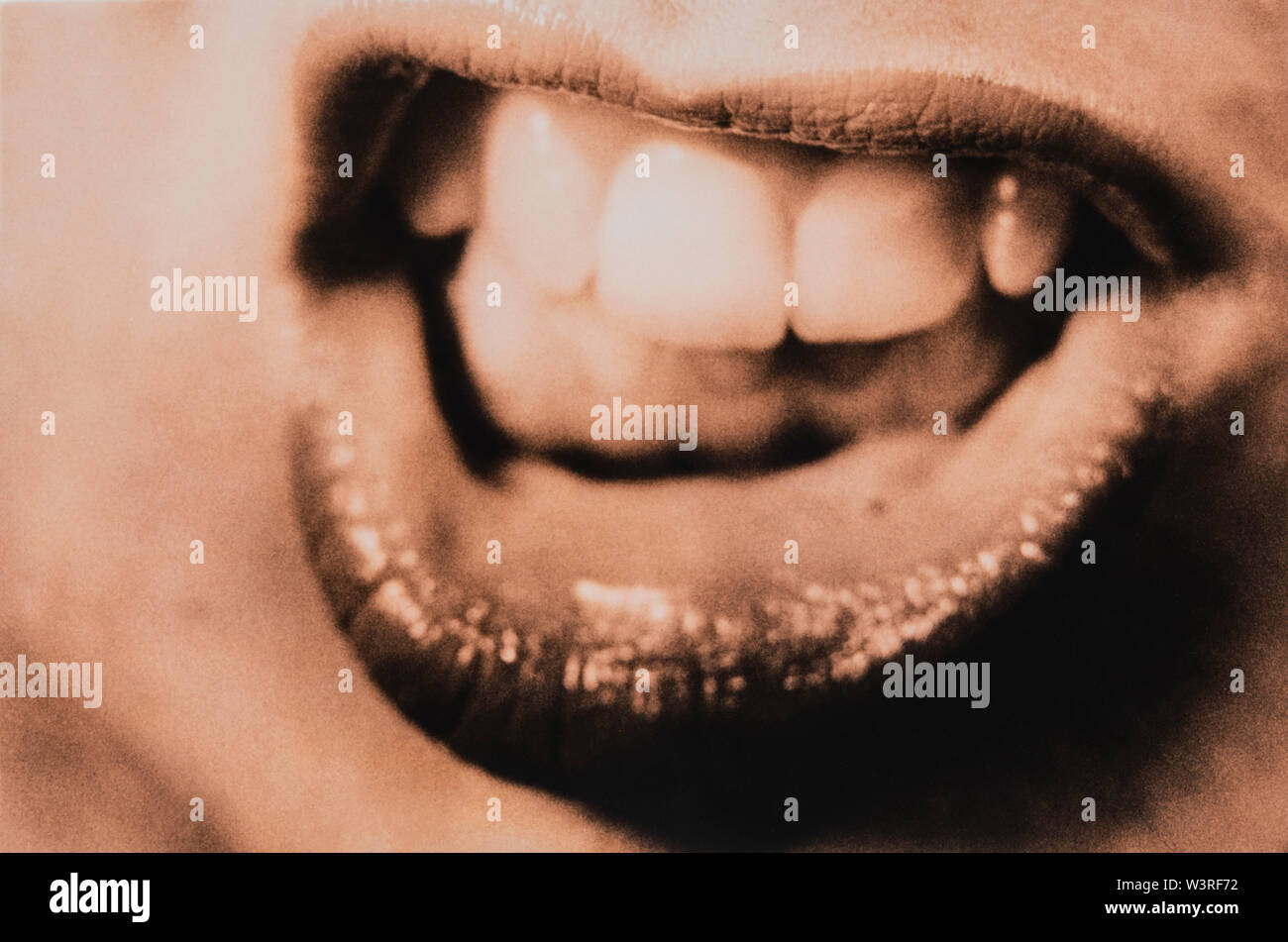 Woman grimacing showing teeth Stock Photo