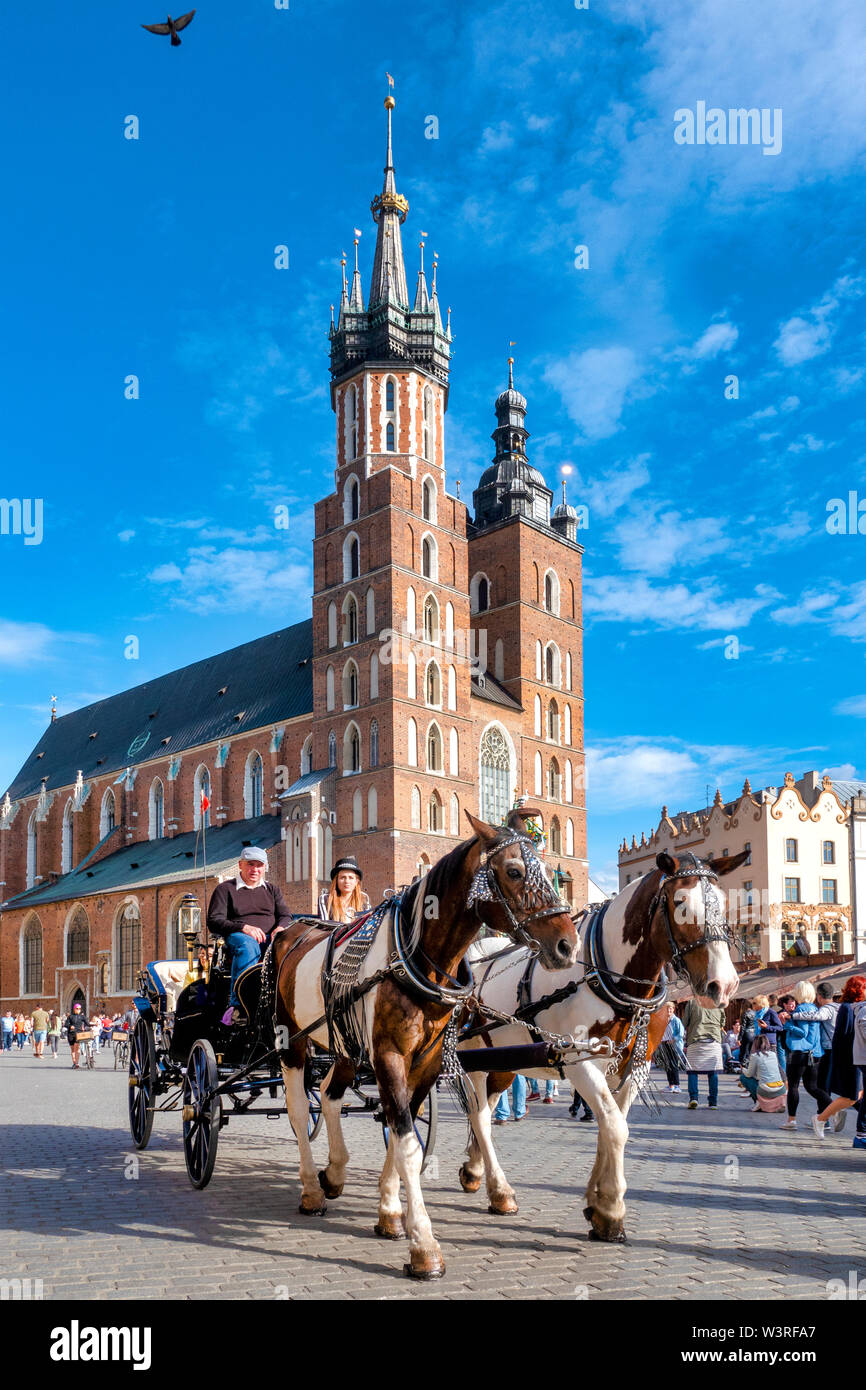 Horse drawn carriage in the Main Market Square, Krakow, Poland Stock Photo