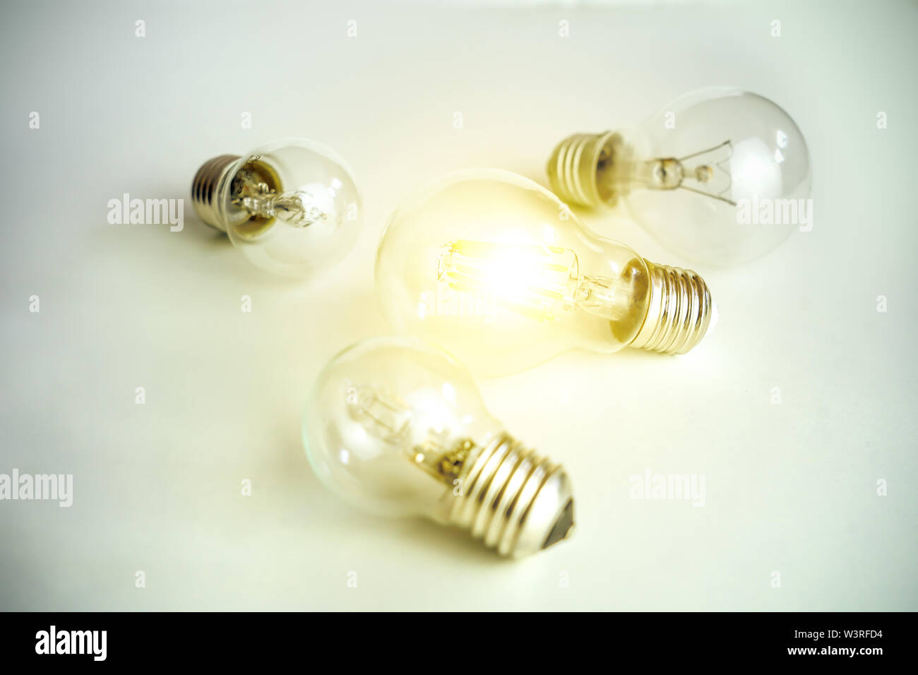 Light bulb lamps on white background one glowing concept of one special idea Stock Photo