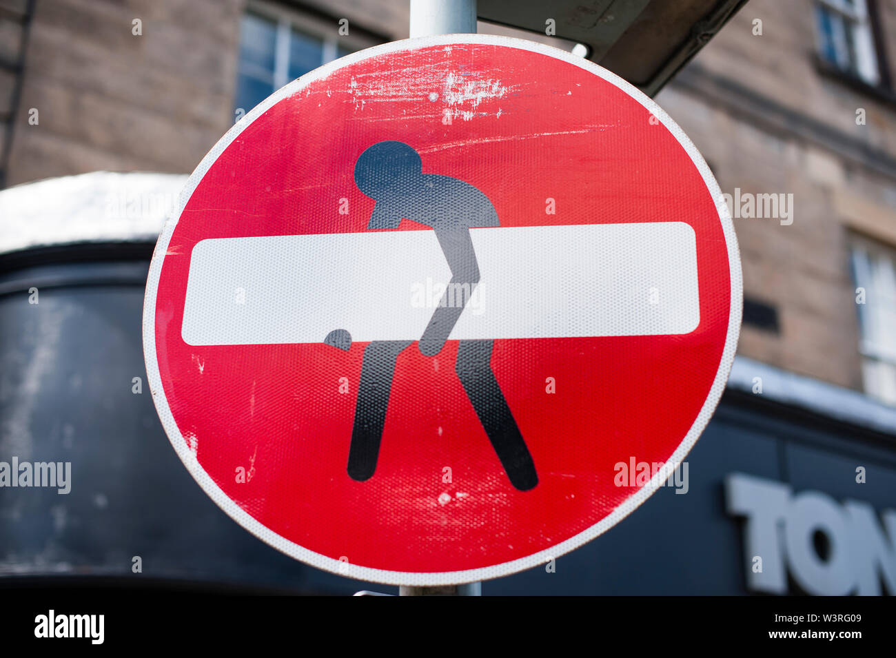 Street signs artistically modified by Clet Abraham in Edinburgh