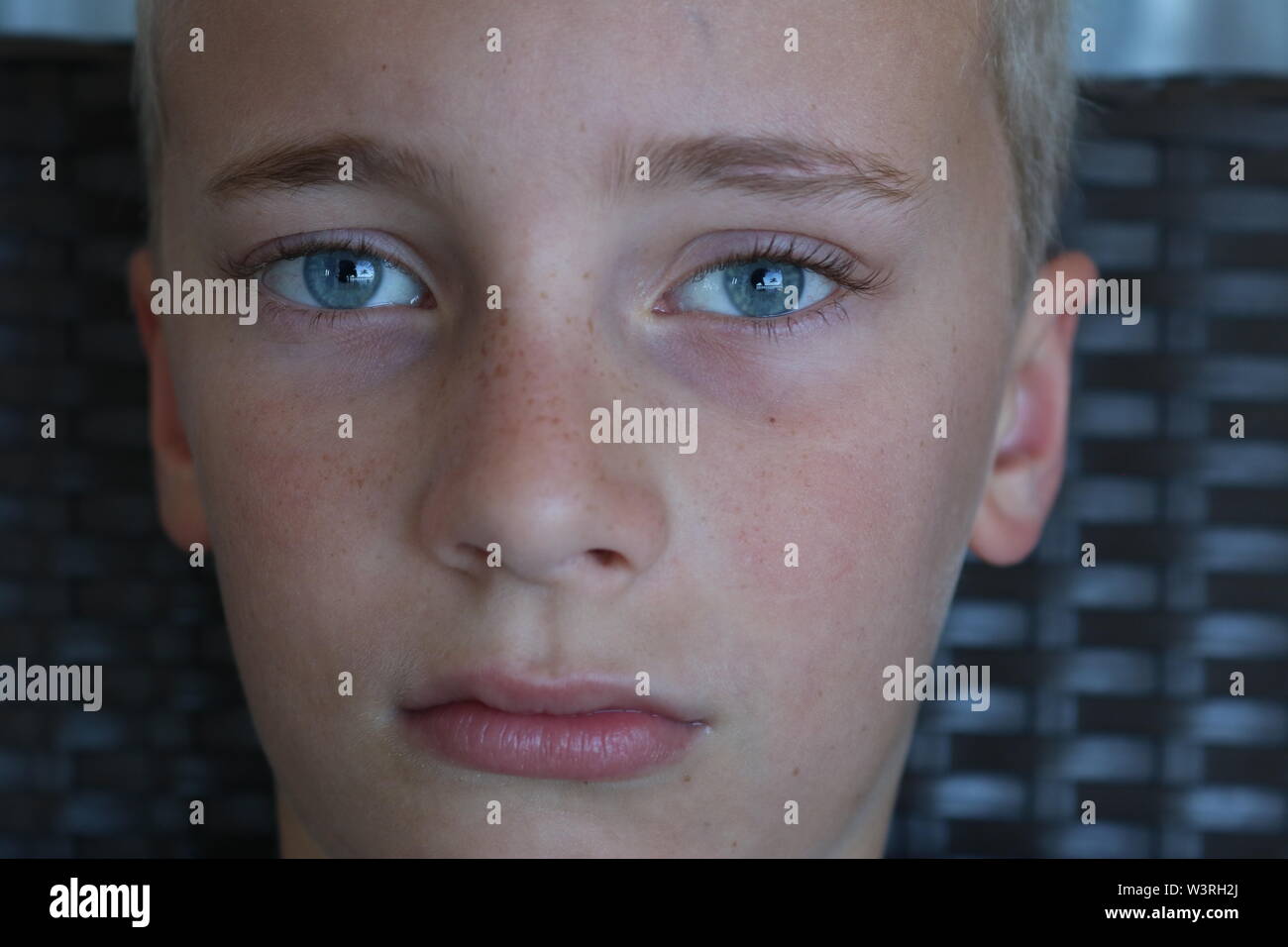 Portrait of an adolescent boy with a serious stare Stock Photo