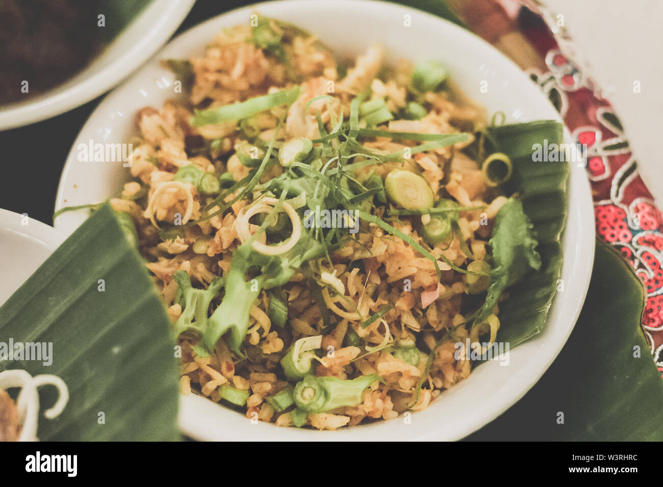 Nasi Ulam Istimewa A spectacular dish of rice with raw herbs, vegetables, minced fish and salted fish Stock Photo