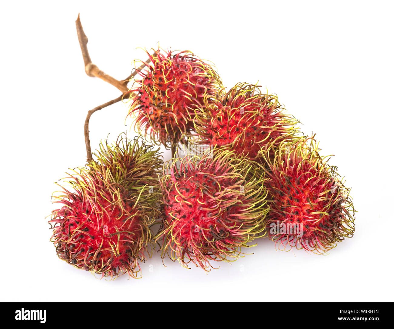 Nephelium lappaceum in front of white background Stock Photo