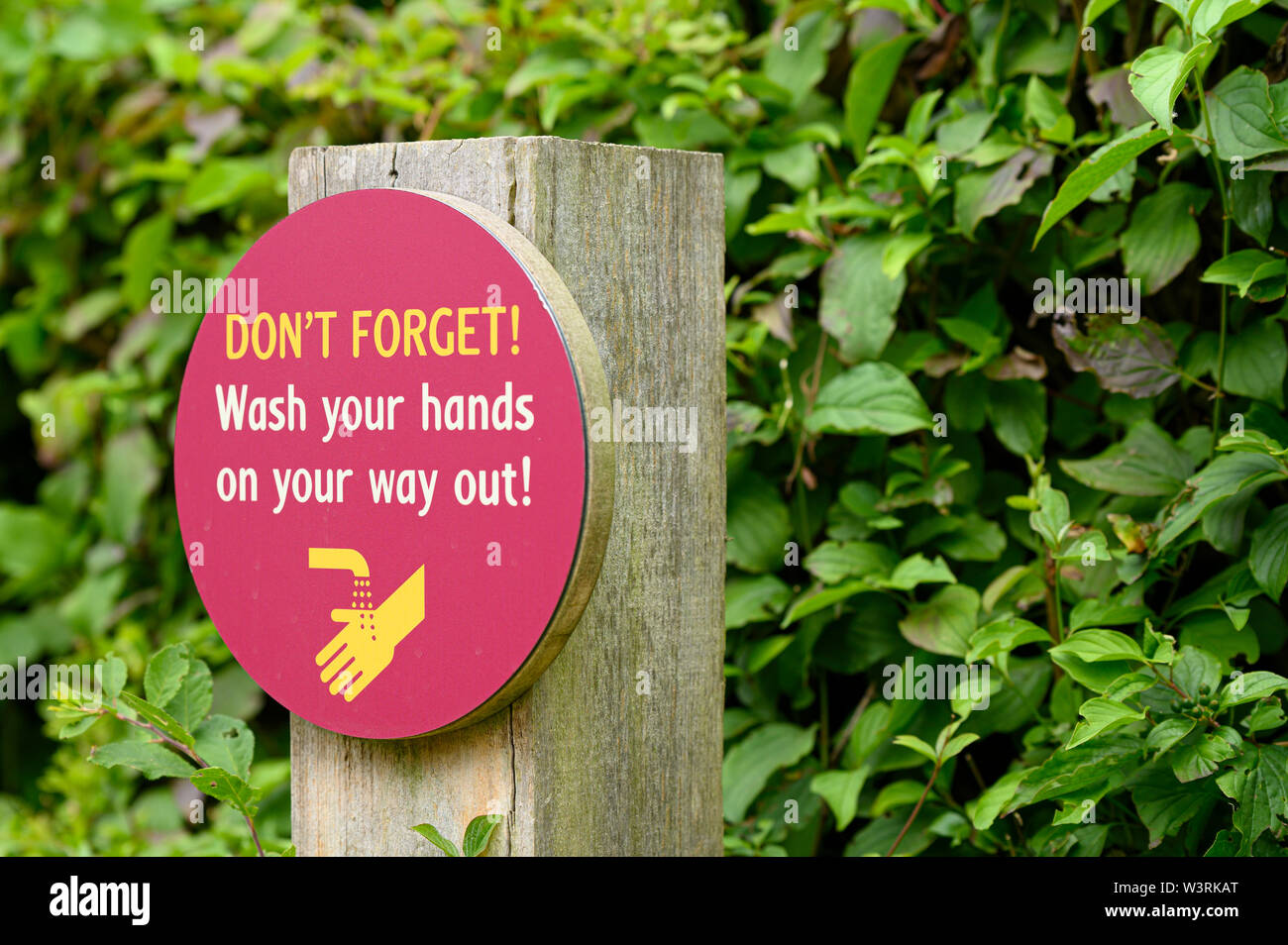 Don't forget wash your hands on your way out sign Stock Photo