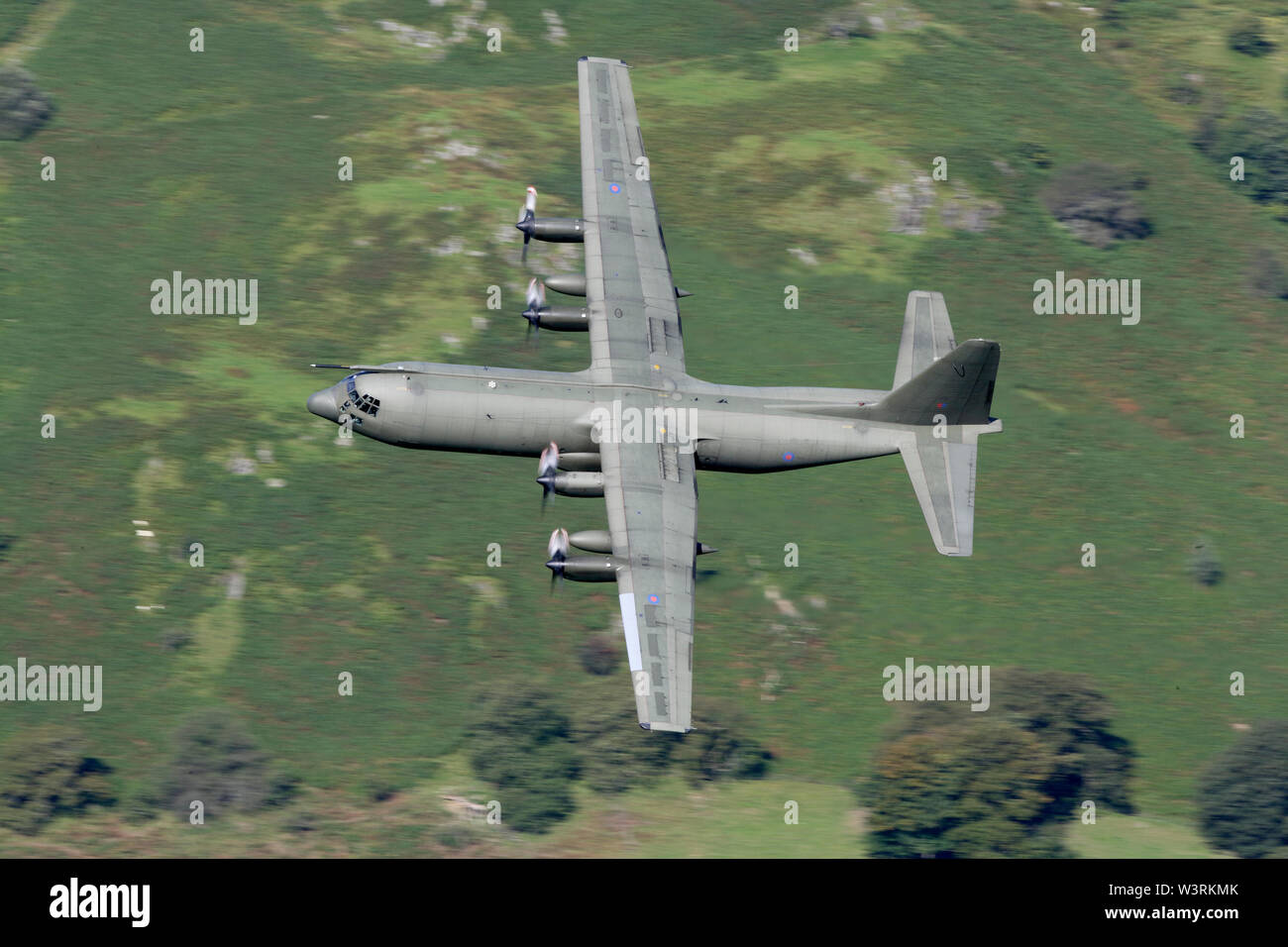 Lockheed C-130K Hercules XV221 C3 turns at Corris corner Mach loop Military Low Flying area Wales Stock Photo