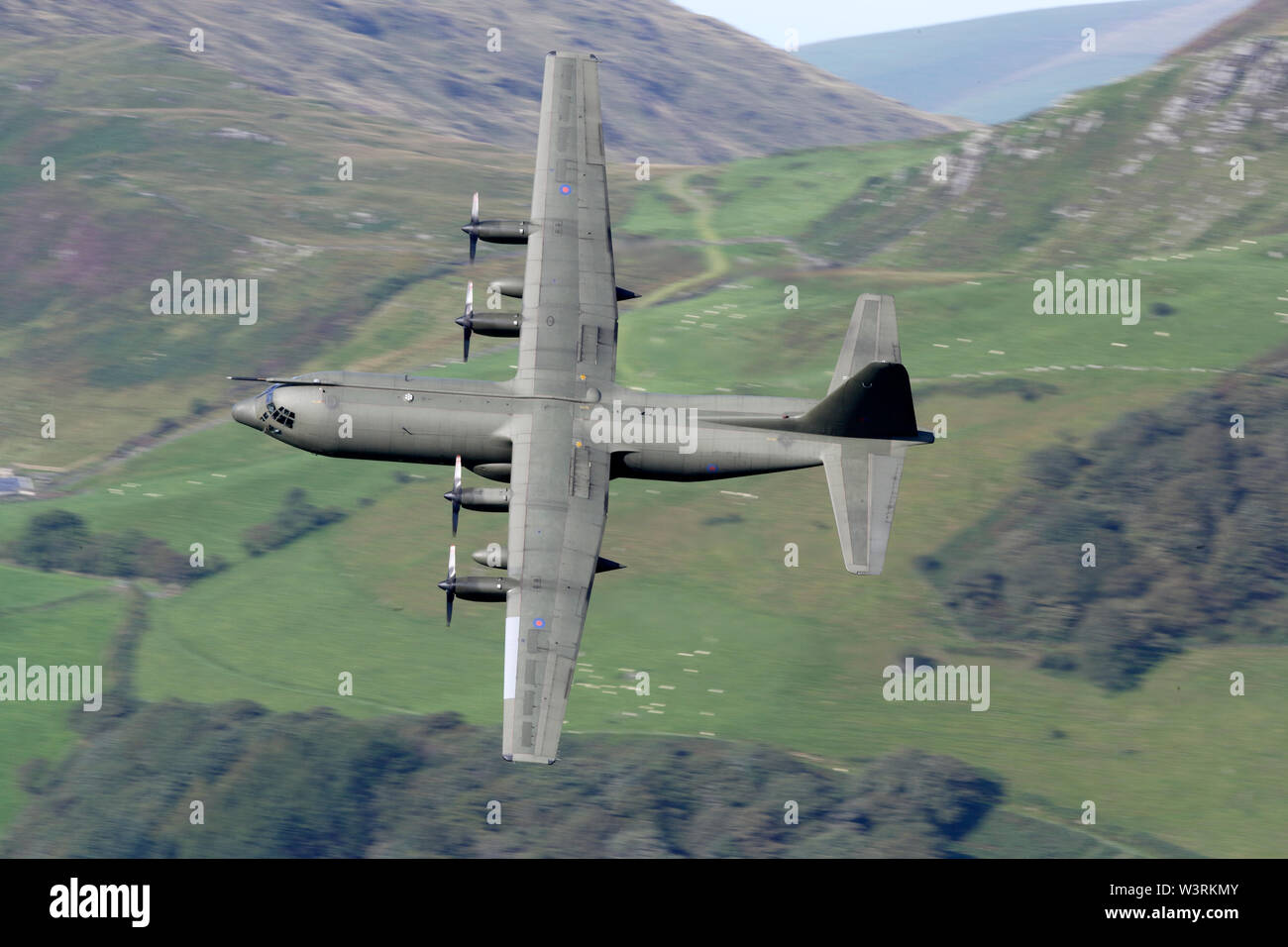 Lockheed C-130K Hercules XV221  C3 turns at Corris corner Mach loop Military Low Flying area Wales Stock Photo