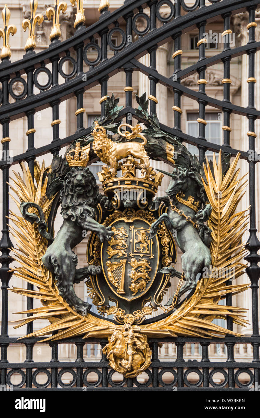 London, UK - July 8th 2014: Vertical close-up view of golden Buckingham Palace gates. Artwork  done by Bromsgrove Guild of Applied Arts Stock Photo