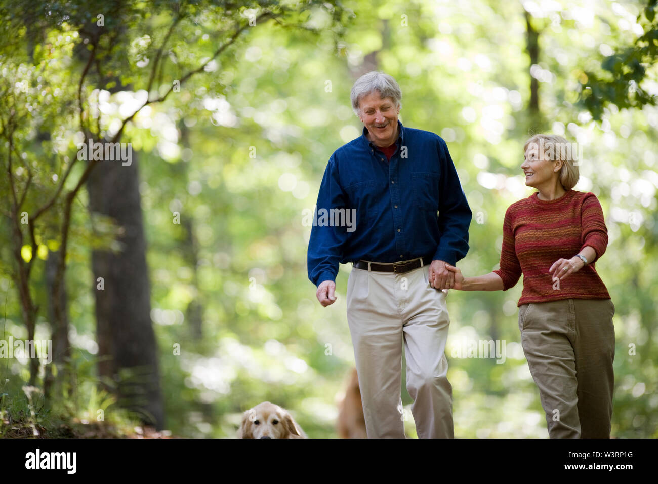 Couple going for a walk in the woods Stock Photo - Alamy